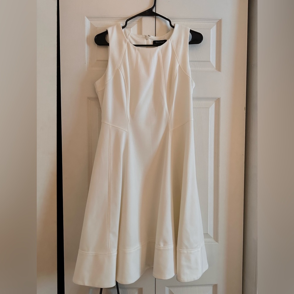 White flare dress size 10. So stains or rips. Never used, hung in closet